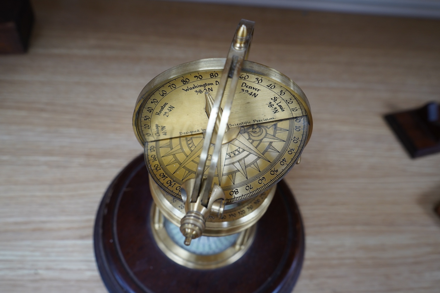 A reproduction brass Astro Visualizer designed by Barrie J Tonkinson and made in England by Culpepper Instruments Ltd., on a hardwood base, 24cm high, with user manual. Condition - fair to good.